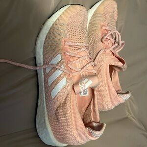 Girls size 4 1/2 peach and white adidas pulseboost tennis shoes.